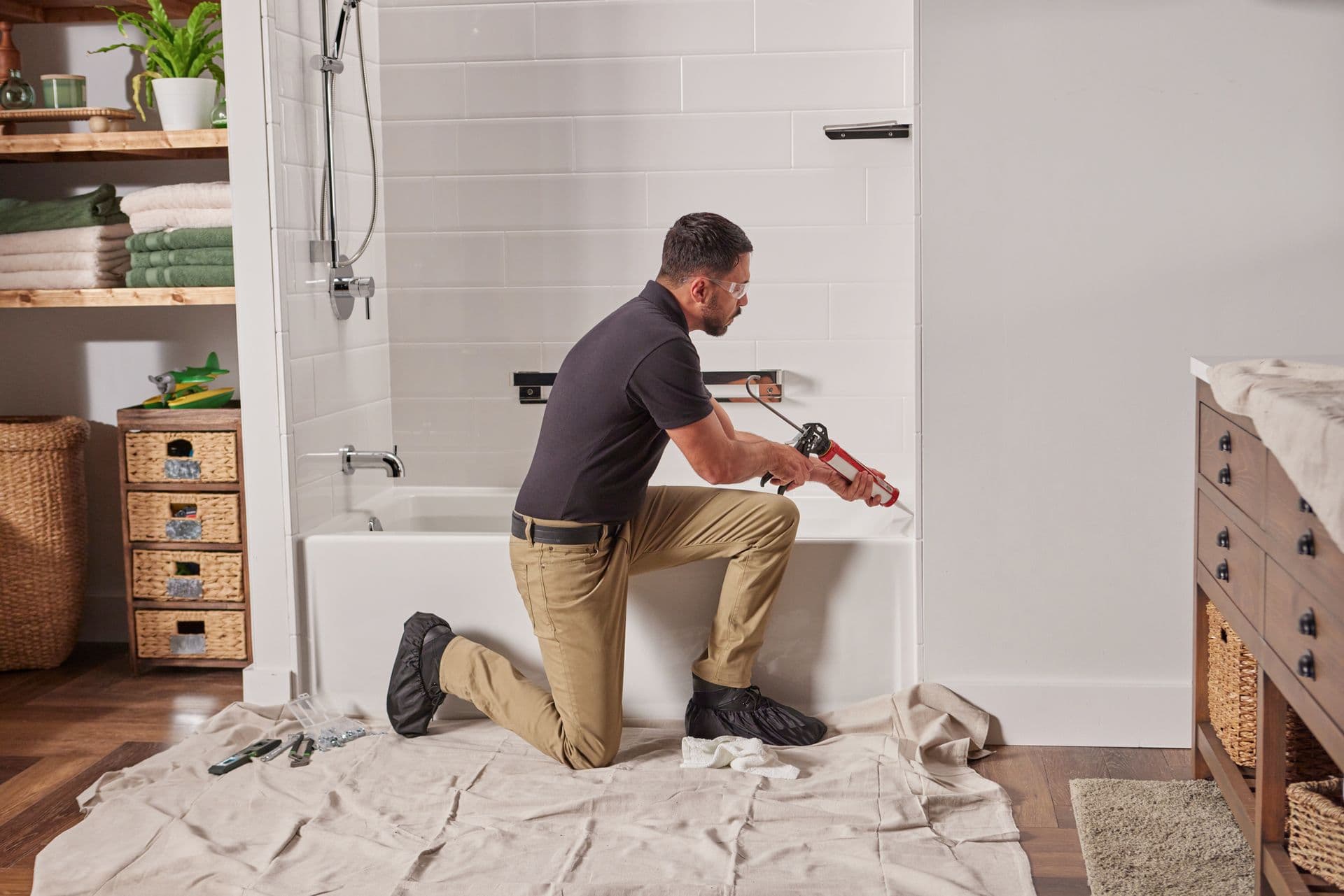 Bathtub with installer