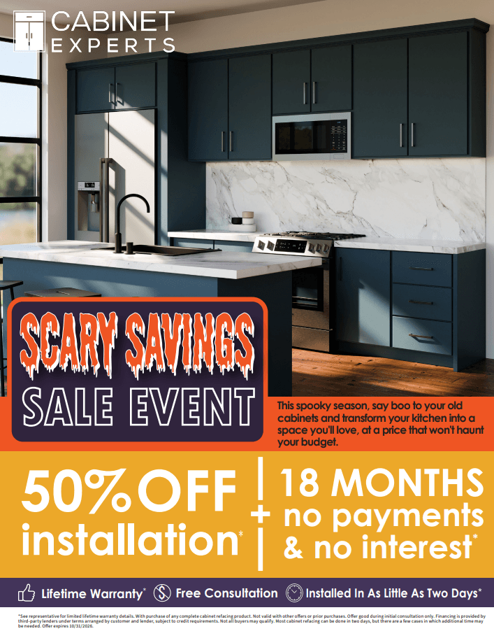 Modern kitchen with dark blue cabinets, white marble backsplash, stainless steel appliances, and island. Cabinet Experts logo top left. Scary Savings Sale Event promotion featuring 50% off installation, 18 months no payments and no interest, with lifetime warranty and free consultation details below