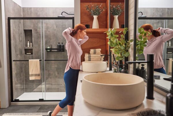 Modern Jacuzzi bathroom remodel featuring a spacious walk-in shower with glass doors and a stylish vanity with vessel sink.